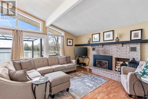 1410 Wagner Road, Central Frontenac (Frontenac Centre), ON - Indoor Photo Showing Living Room With Fireplace