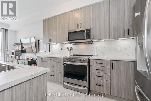 70 Edminston Drive, Centre Wellington, ON - Indoor Photo Showing Kitchen With Upgraded Kitchen