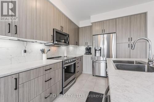 70 Edminston Drive, Centre Wellington, ON - Indoor Photo Showing Kitchen With Double Sink With Upgraded Kitchen