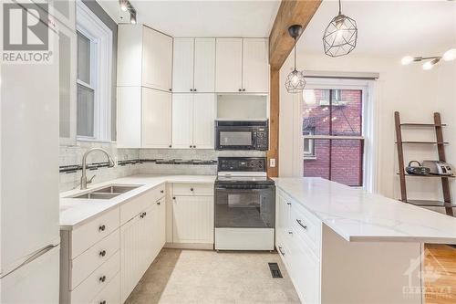 128 Flora Street, Ottawa Centre (4103 - Ottawa Centre), ON - Indoor Photo Showing Kitchen With Double Sink