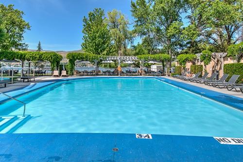 2402-7343 Okanagan Landing Road, Vernon, BC - Outdoor With In Ground Pool With Backyard