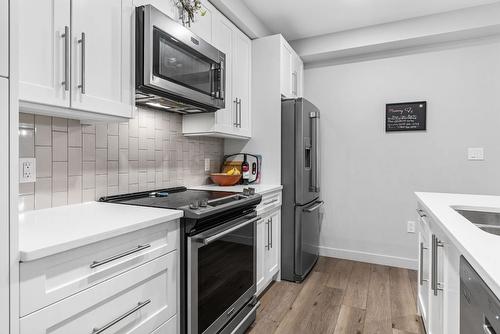 106-3630 Mission Springs Drive, Kelowna, BC - Indoor Photo Showing Kitchen With Double Sink