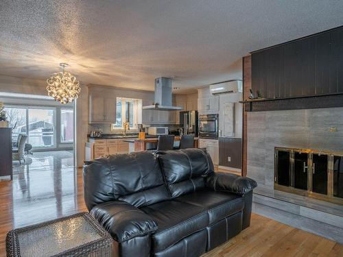 Living room - 555 Route 108 E., Saint-Victor, QC - Indoor Photo Showing Living Room With Fireplace