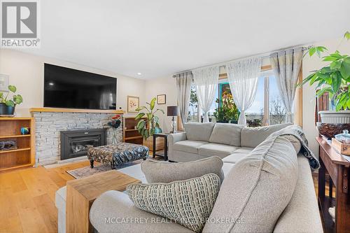 3364 County Rd 1 E, Stone Mills, ON - Indoor Photo Showing Living Room With Fireplace