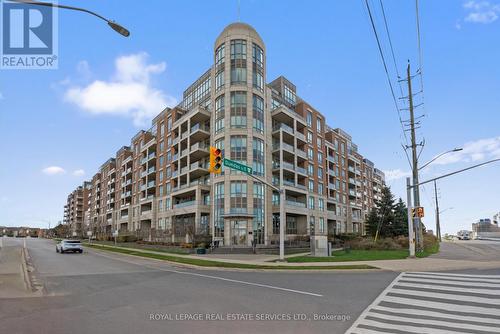 208 - 2480 Prince Michael Drive, Oakville, ON - Outdoor With Balcony With Facade