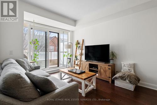 208 - 2480 Prince Michael Drive, Oakville, ON - Indoor Photo Showing Living Room