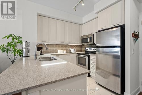 208 - 2480 Prince Michael Drive, Oakville, ON - Indoor Photo Showing Kitchen With Stainless Steel Kitchen With Double Sink With Upgraded Kitchen