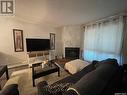 104 2511 Neff Road E, Regina, SK  - Indoor Photo Showing Living Room With Fireplace 