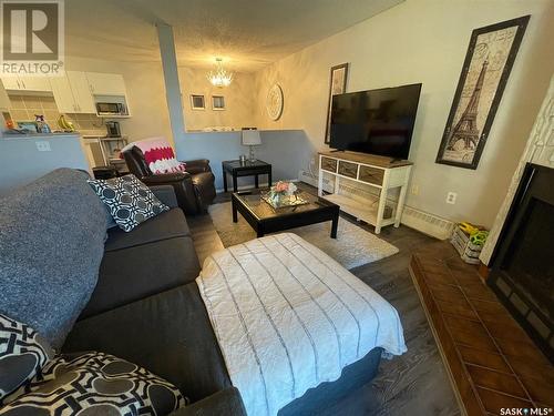 104 2511 Neff Road E, Regina, SK - Indoor Photo Showing Living Room With Fireplace