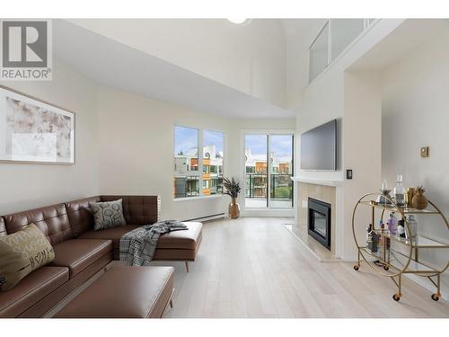 414 1150 Quayside Drive, New Westminster, BC - Indoor Photo Showing Living Room With Fireplace