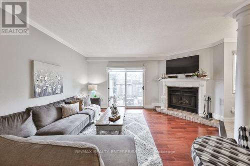 35 - 3050 Orleans Road, Mississauga, ON - Indoor Photo Showing Living Room With Fireplace