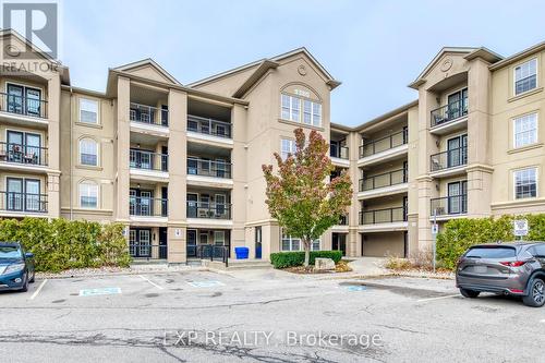 309 - 1380 Main Street E, Milton, ON - Outdoor With Balcony With Facade