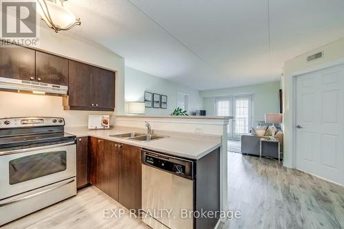 309 - 1380 Main Street E, Milton, ON - Indoor Photo Showing Kitchen With Double Sink