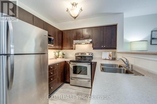 309 - 1380 Main Street E, Milton, ON - Indoor Photo Showing Kitchen With Stainless Steel Kitchen With Double Sink