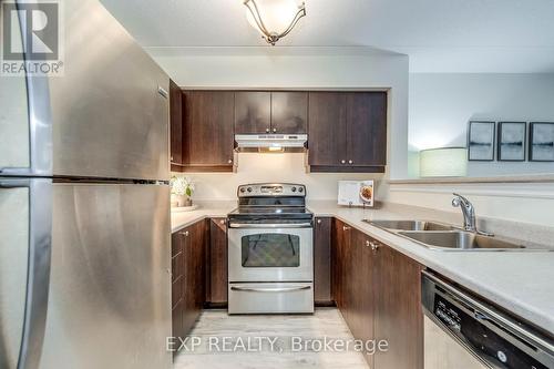 309 - 1380 Main Street E, Milton, ON - Indoor Photo Showing Kitchen With Stainless Steel Kitchen With Double Sink