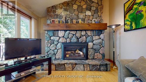 26 Evans Drive, Kawartha Lakes, ON - Indoor With Fireplace