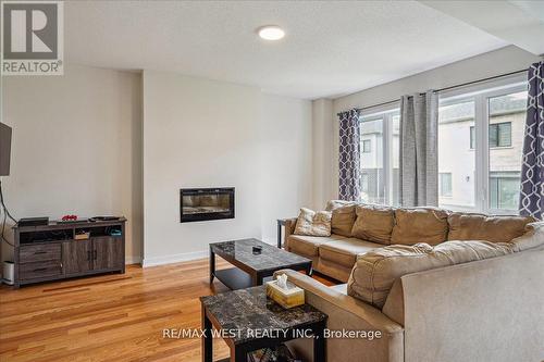 17 Wintergreen Crescent, Haldimand, ON - Indoor Photo Showing Living Room With Fireplace