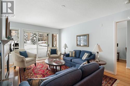 2101, 303 Arbour Crest Drive Nw, Calgary, AB - Indoor Photo Showing Living Room