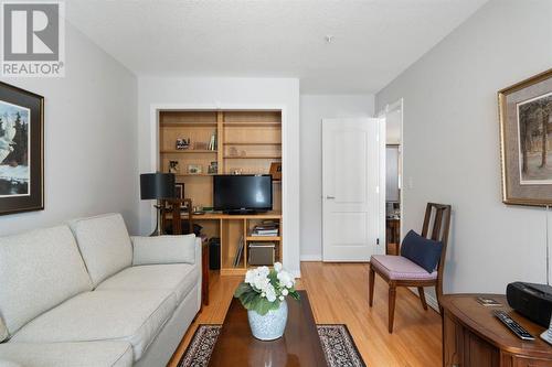 2101, 303 Arbour Crest Drive Nw, Calgary, AB - Indoor Photo Showing Living Room