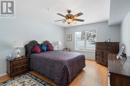 2101, 303 Arbour Crest Drive Nw, Calgary, AB - Indoor Photo Showing Bedroom