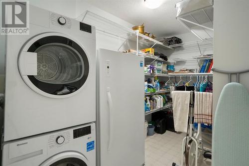 2101, 303 Arbour Crest Drive Nw, Calgary, AB - Indoor Photo Showing Laundry Room