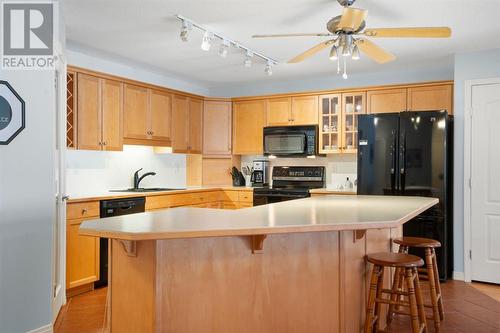 2101, 303 Arbour Crest Drive Nw, Calgary, AB - Indoor Photo Showing Kitchen