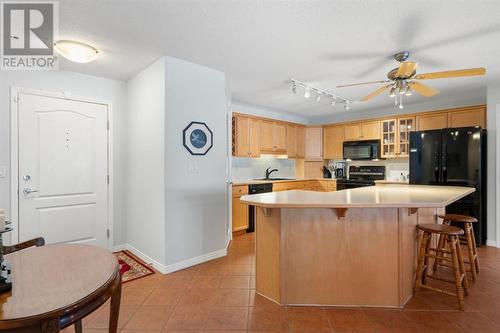 2101, 303 Arbour Crest Drive Nw, Calgary, AB - Indoor Photo Showing Kitchen