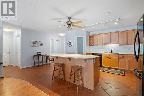 2101, 303 Arbour Crest Drive Nw, Calgary, AB - Indoor Photo Showing Kitchen