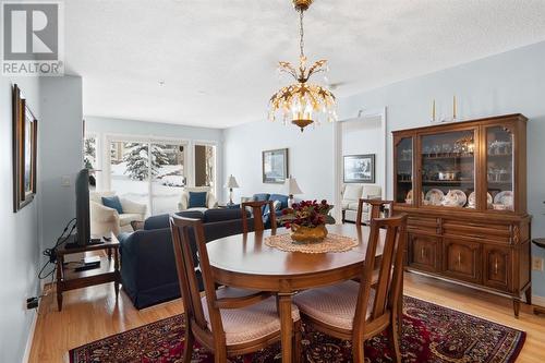 2101, 303 Arbour Crest Drive Nw, Calgary, AB - Indoor Photo Showing Dining Room