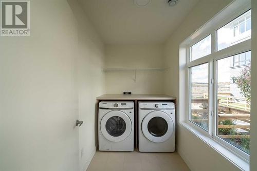 504, 857 Belmont Drive Sw, Calgary, AB - Indoor Photo Showing Laundry Room