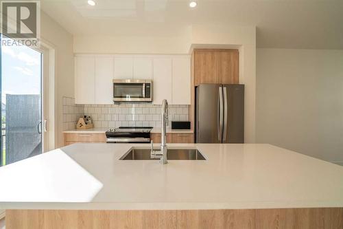 504, 857 Belmont Drive Sw, Calgary, AB - Indoor Photo Showing Kitchen With Double Sink With Upgraded Kitchen