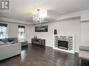 90 - 2280 Baronwood Drive, Oakville, ON  - Indoor Photo Showing Living Room With Fireplace 