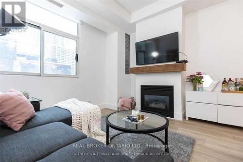 201 - 8 Wellesley Street, Toronto, ON - Indoor Photo Showing Living Room With Fireplace