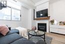 201 - 8 Wellesley Street, Toronto, ON  - Indoor Photo Showing Living Room With Fireplace 