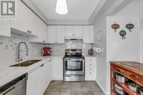 64 Natale Court, Bradford West Gwillimbury, ON - Indoor Photo Showing Kitchen With Double Sink