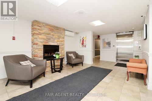 1005 - 64 Benton Street E, Kitchener, ON - Indoor With Fireplace