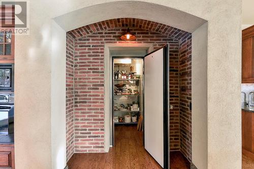 Wine Cellar - 1180 Stoneypointe Court, Kelowna, BC - Indoor Photo Showing Other Room With Fireplace