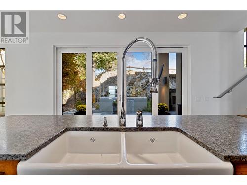 Farmhouse sink view toward deck - 1180 Stoneypointe Court, Kelowna, BC - Indoor Photo Showing Other Room