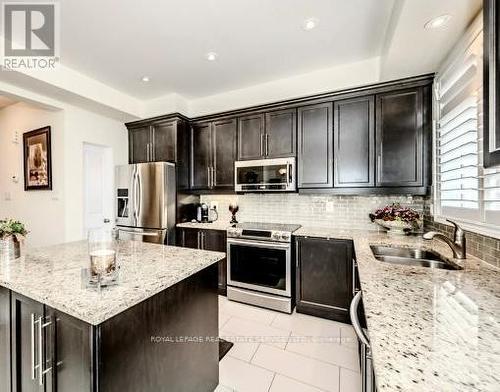 25 Rockman Crescent W, Brampton, ON - Indoor Photo Showing Kitchen With Stainless Steel Kitchen With Double Sink With Upgraded Kitchen