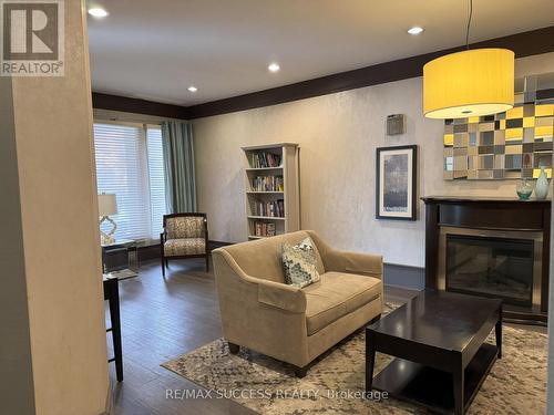 901 - 67 Caroline Street S, Hamilton, ON - Indoor Photo Showing Living Room With Fireplace