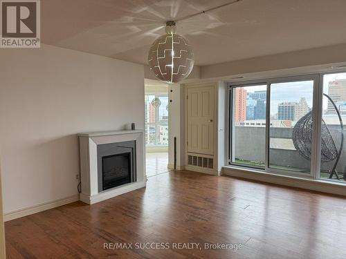 901 - 67 Caroline Street S, Hamilton, ON - Indoor Photo Showing Living Room With Fireplace