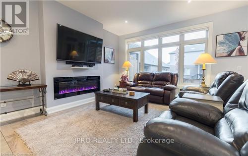 18 - 9245 Shoveller Avenue, Niagara Falls, ON - Indoor Photo Showing Living Room With Fireplace