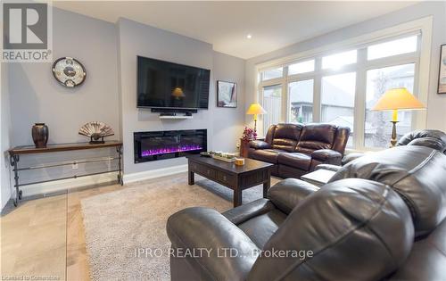 18 - 9245 Shoveller Avenue, Niagara Falls, ON - Indoor Photo Showing Living Room With Fireplace