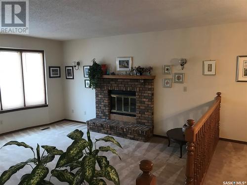 7627 Discovery Road, Regina, SK - Indoor Photo Showing Other Room With Fireplace