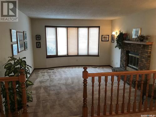 7627 Discovery Road, Regina, SK - Indoor Photo Showing Other Room With Fireplace