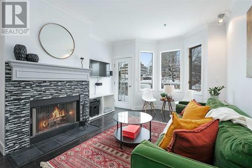 304, 916 19 Avenue Sw, Calgary, AB - Indoor Photo Showing Living Room With Fireplace