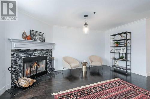 304, 916 19 Avenue Sw, Calgary, AB - Indoor Photo Showing Living Room With Fireplace