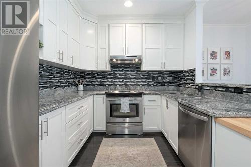 304, 916 19 Avenue Sw, Calgary, AB - Indoor Photo Showing Kitchen With Stainless Steel Kitchen With Upgraded Kitchen