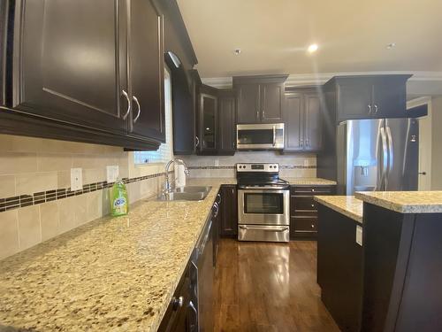 Main 7159 196 Street, Langley, BC - Indoor Photo Showing Kitchen With Double Sink With Upgraded Kitchen