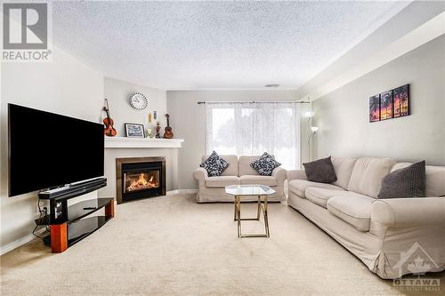 1672 Locksley Lane, Ottawa, ON - Indoor Photo Showing Living Room With Fireplace